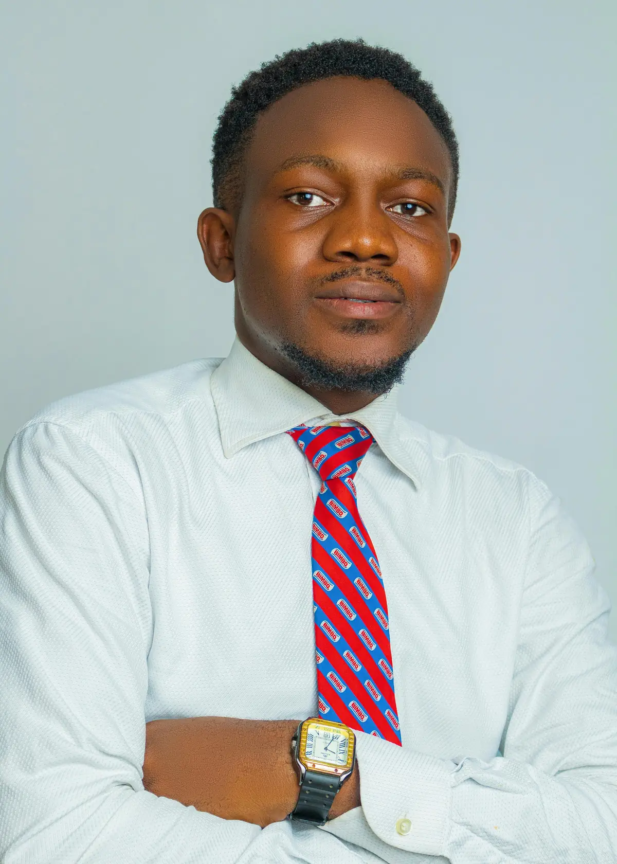A confident businessman in a white shirt and tie, photographed in Lagos